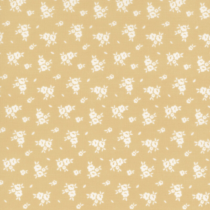 Swatch of light tan fabric with scattered white flower silhouettes 