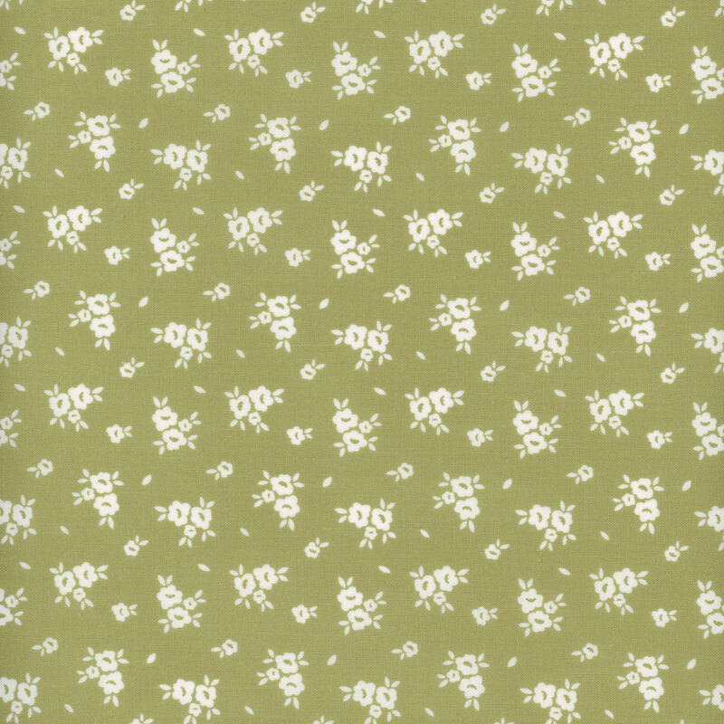 Swatch of jade green fabric with scattered white flower silhouettes