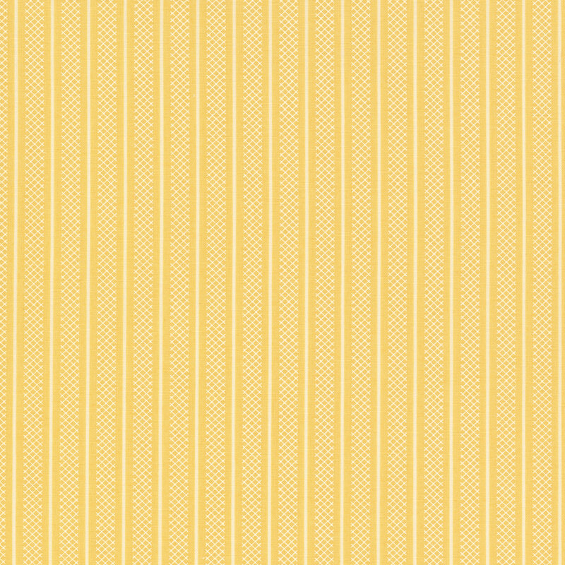 Swatch of butter yellow fabric with thin white stripes and wider white stripes of lattice patterning