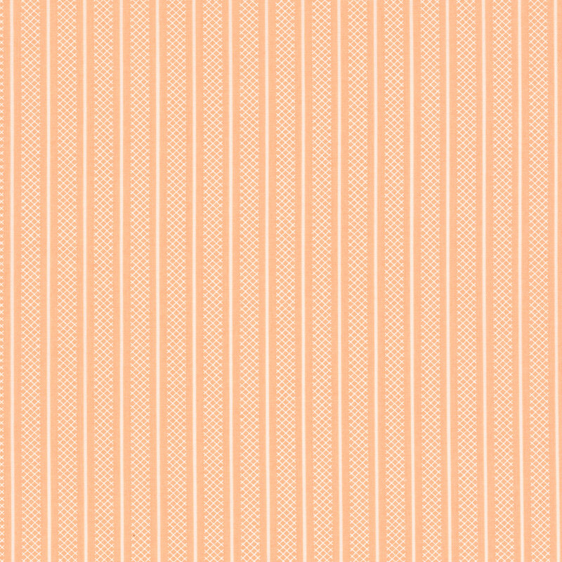 Swatch of peach fabric with thin white stripes and wider white stripes of lattice patterning