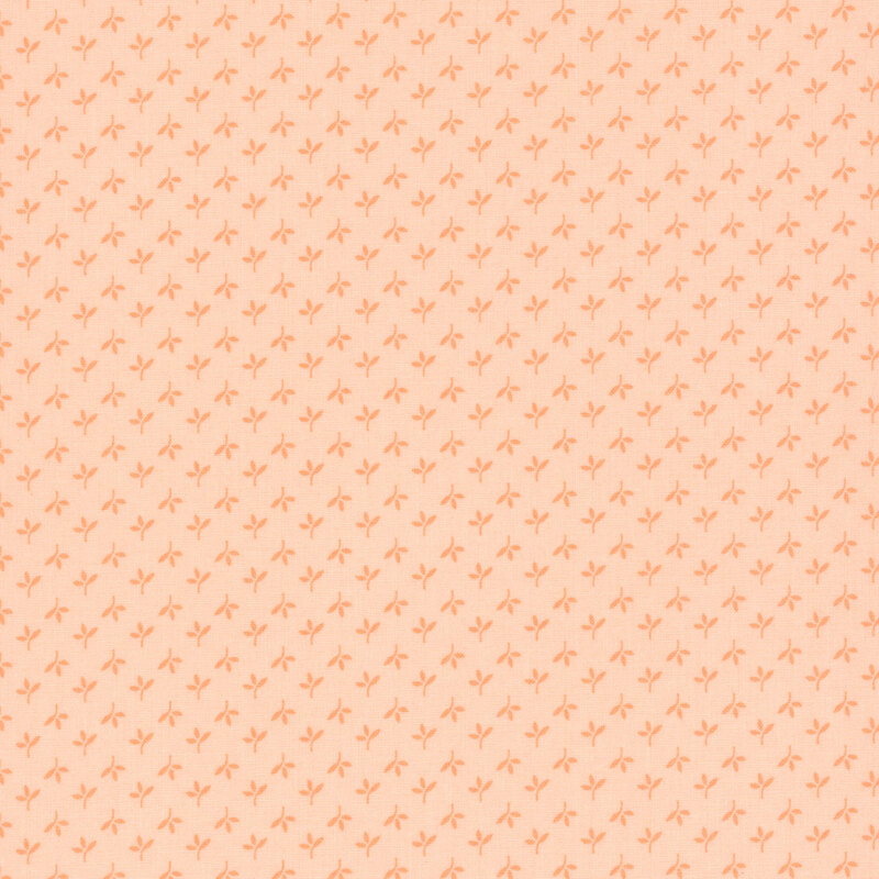 Swatch of peach fabric with alternating rows of tonal leaves
