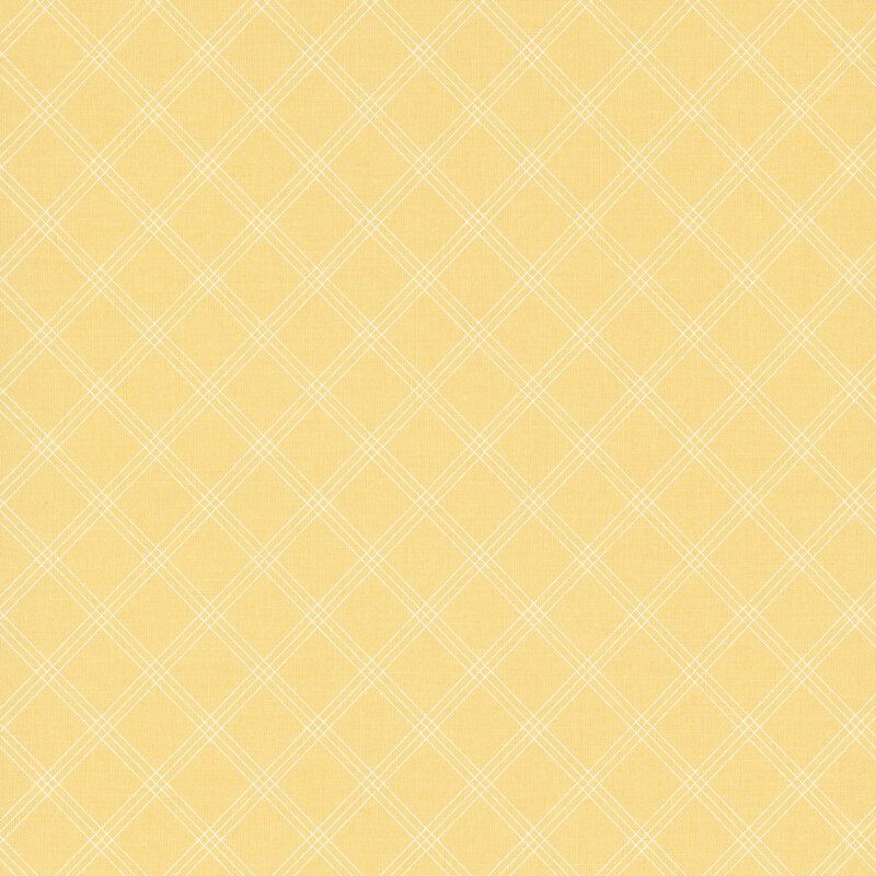 Swatch of light yellow fabric with a simple thin plaid pattern