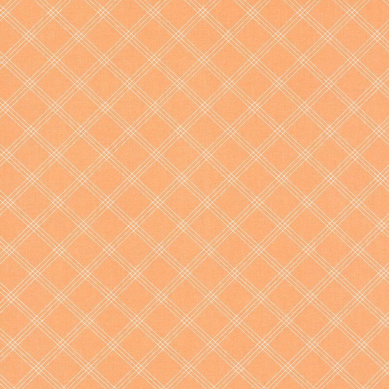 Swatch of peach fabric with a simple thin plaid pattern