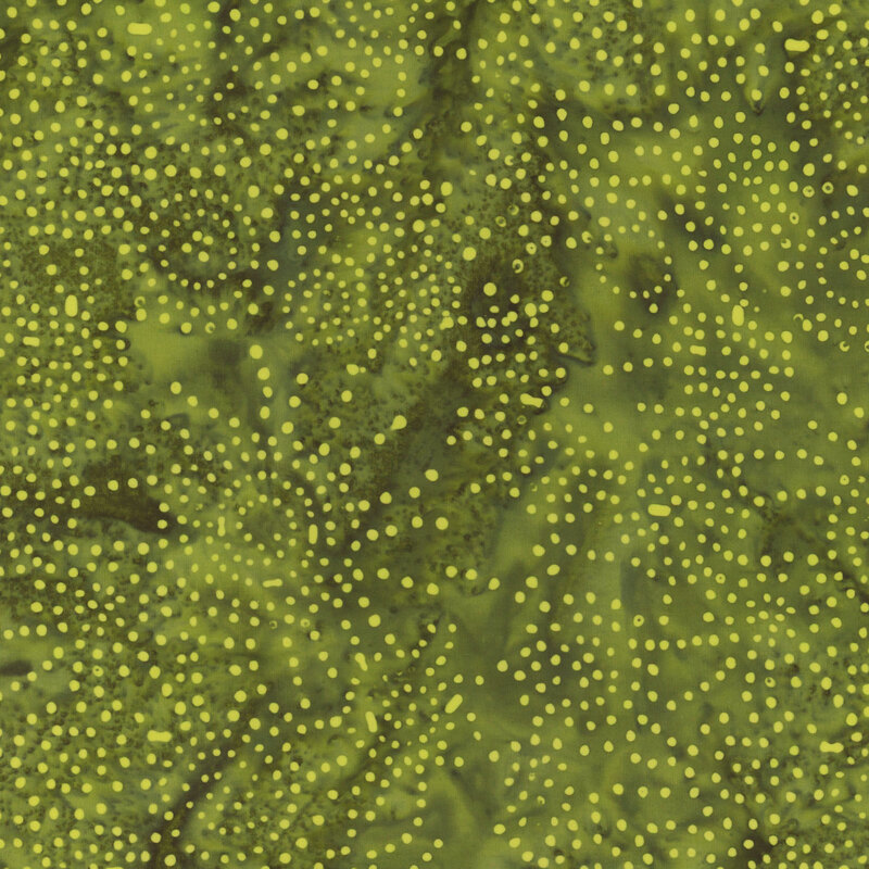 Dark green fabric mottled with lighter green/yellow dots.
