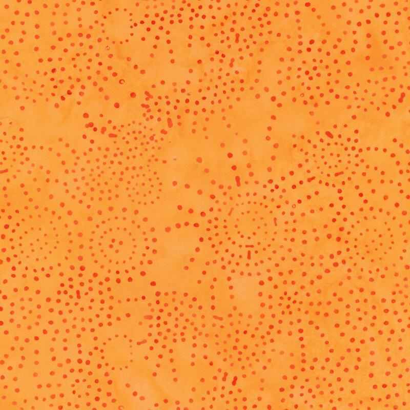 Orange fabric with mottled red dots.