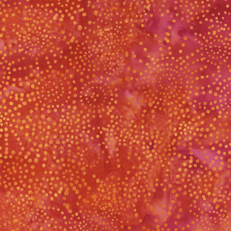 Red and pink fabric mottled with lighter orange dots.
