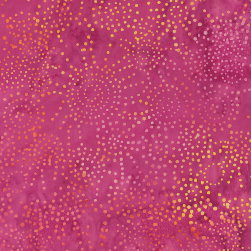 Pink fabric mottled with orange, pink, and yellow dots.