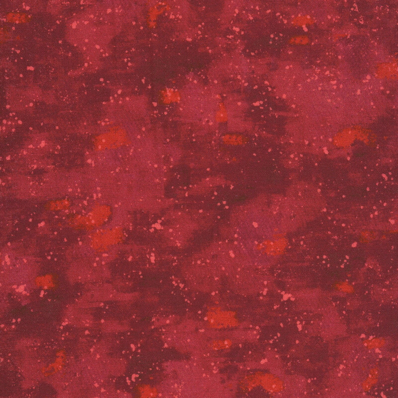This fabric has a tonal dark red painted and splattered texture
