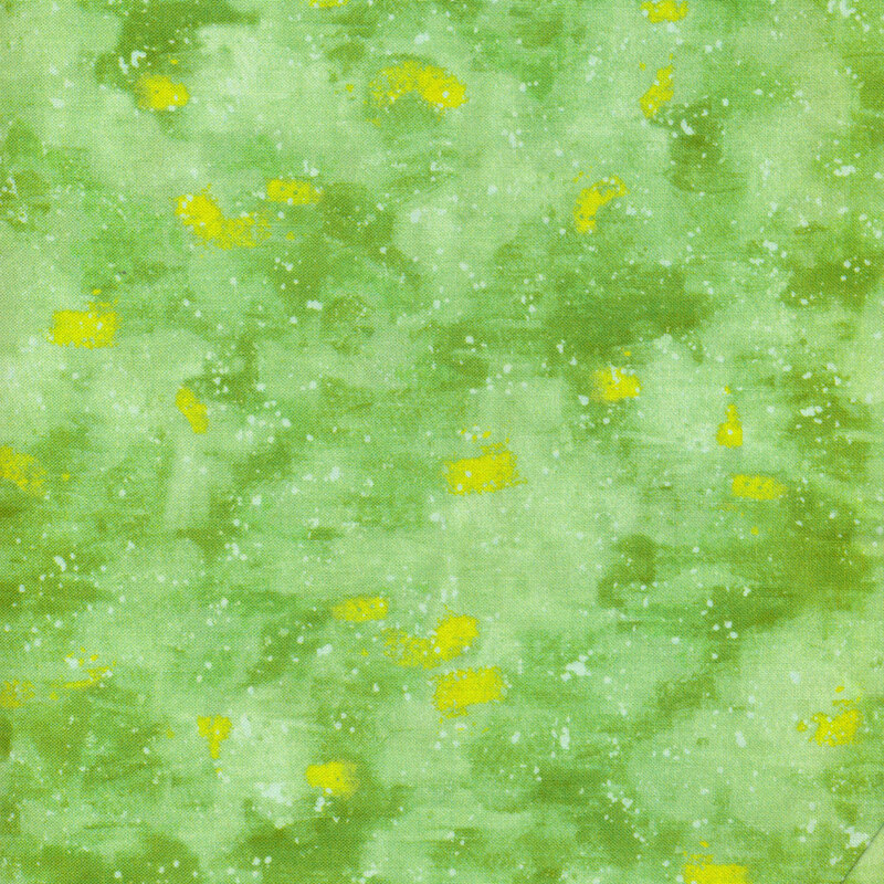 This fabric has a light green painted texture with yellow splatters