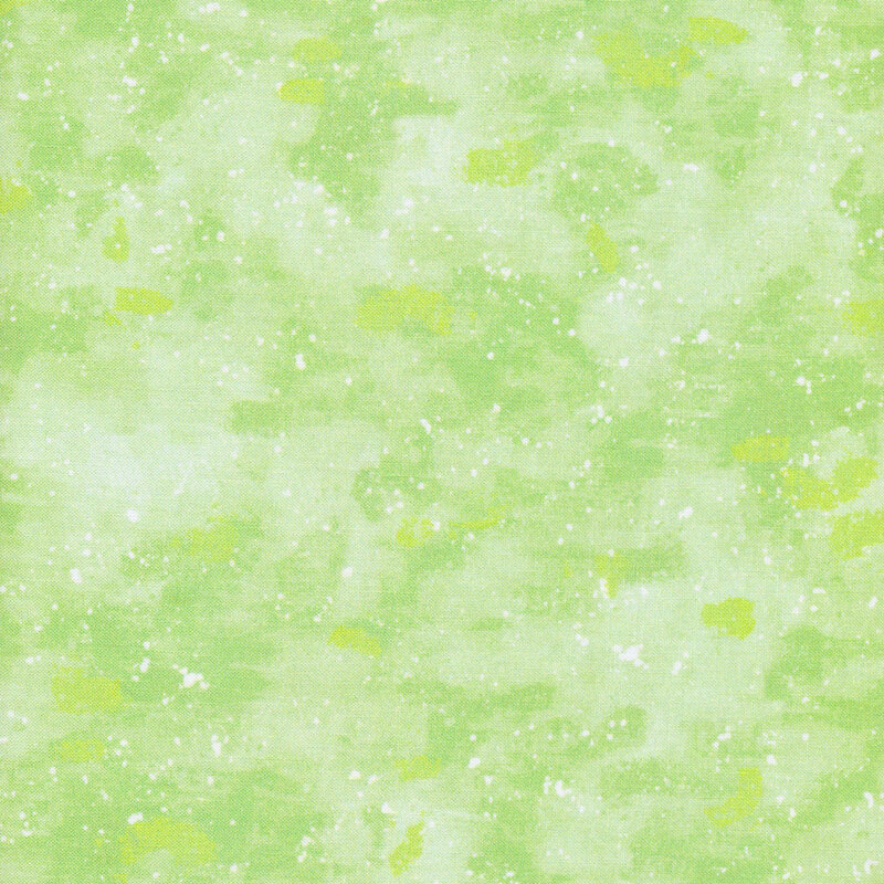 This fabric has a tonal light green painted and splattered texture