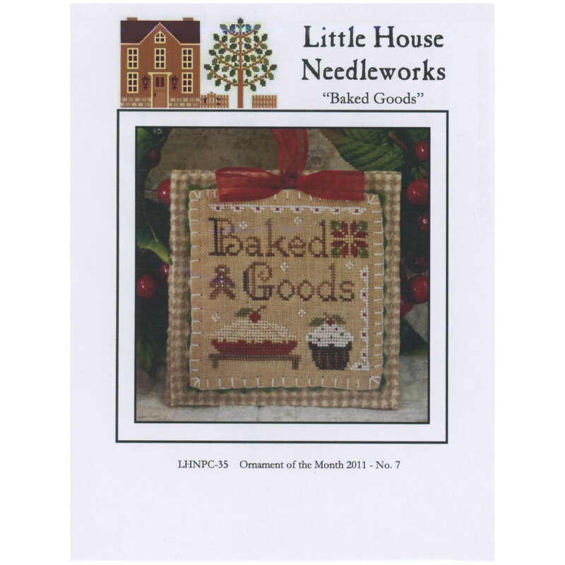 Front of pattern showing the completed small cross stitch ornament staged under a christmas tree