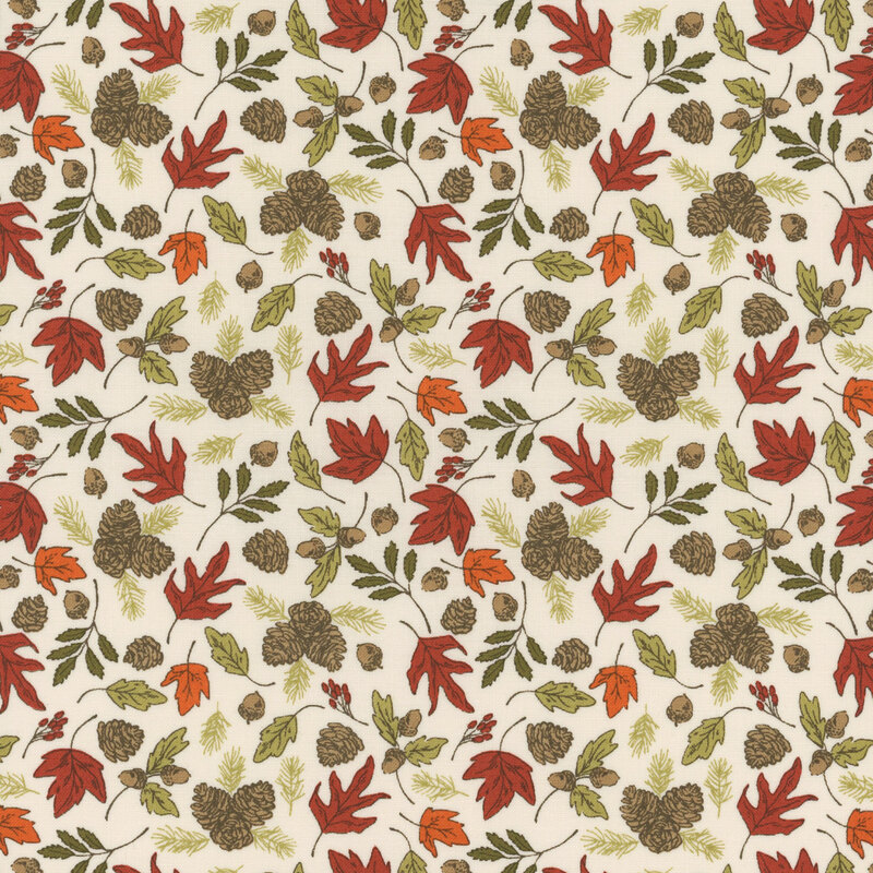 Cream fabric covered in tossed fall leaves in red, orange, green, and brown with acorns and pinecones.