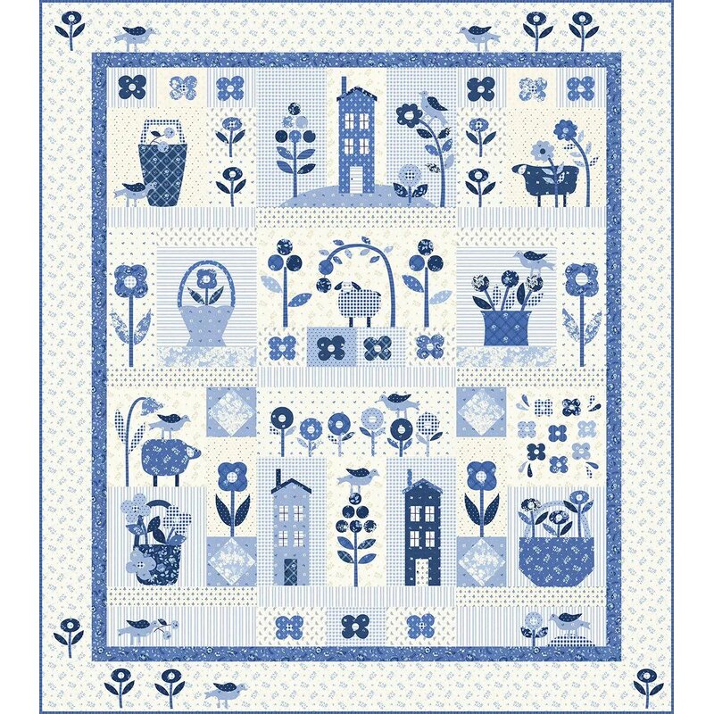 Head on shot of the full finished quilt, a beautiful, soft blue and white project