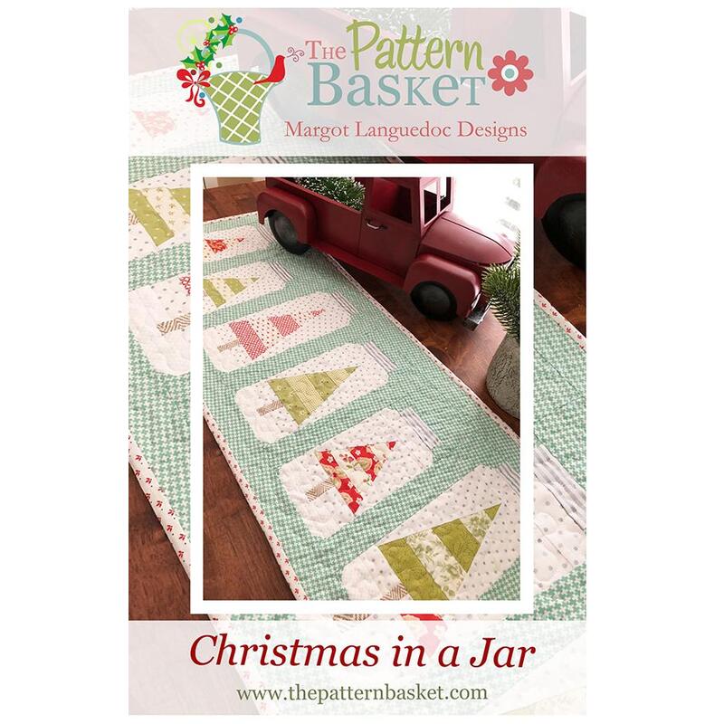 Front of Christmas Jars pattern showing the completed table runner stages on a dining table with a little red truck