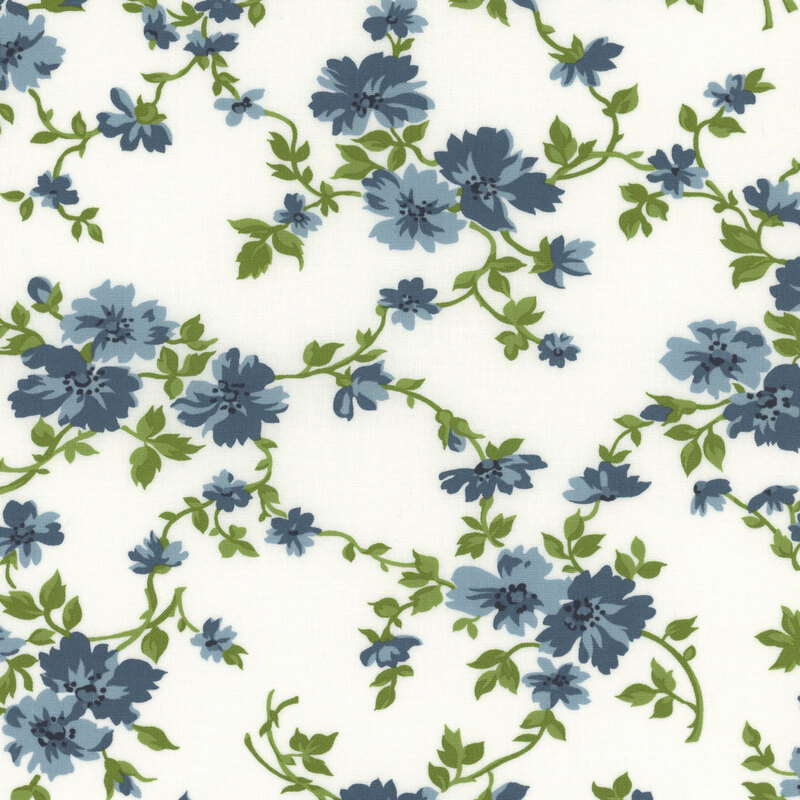 light cream fabric with flowing green vines and blue flowers