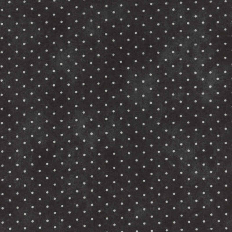 Mottled black fabric with small white polka dots.