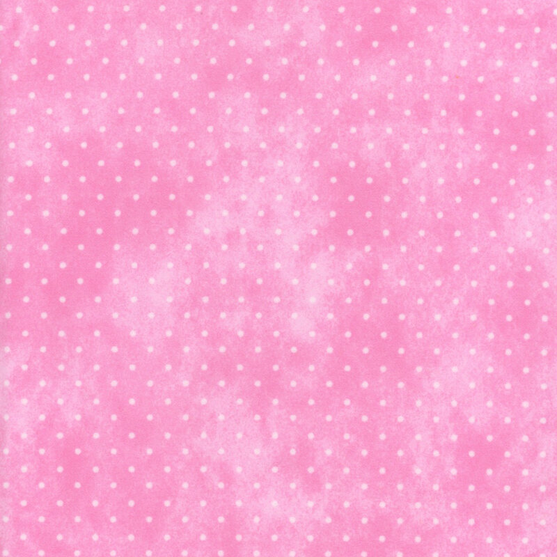 Mottled pink fabric with small white polka dots.