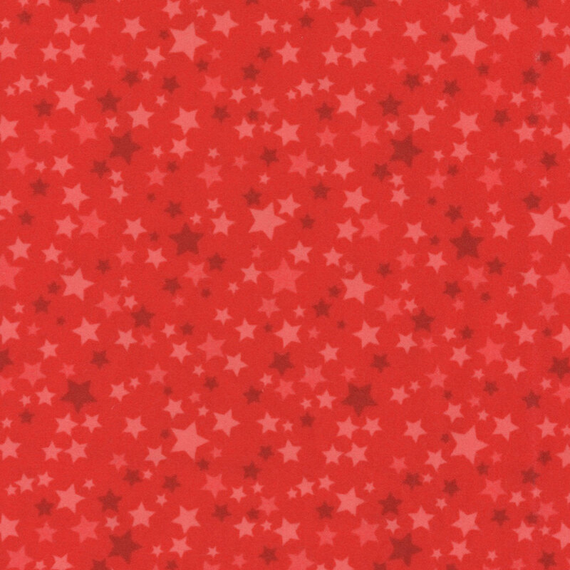 Red fabric with a variety of red stars.