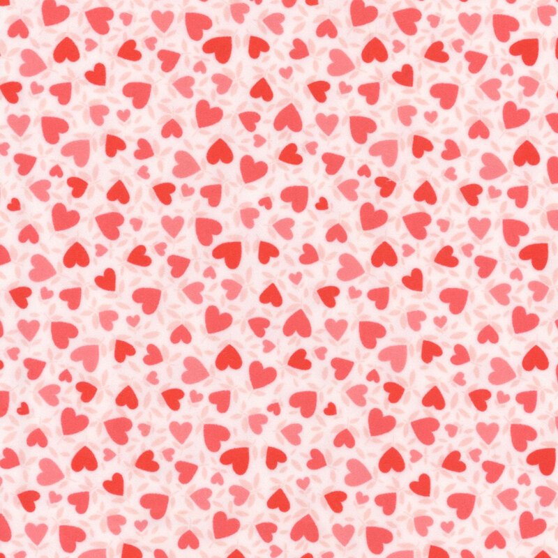 White fabric with a pattern of red hearts.