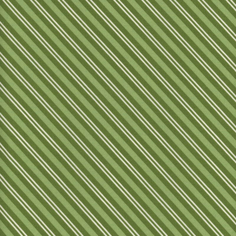 Dark green fabric with diagonal stripes of varying widths in light green and cream