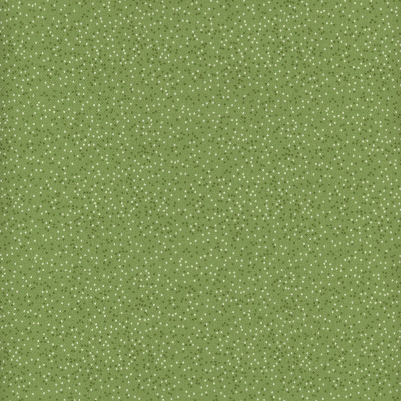 Light green fabric with tiny, light and dark tonal dots all over