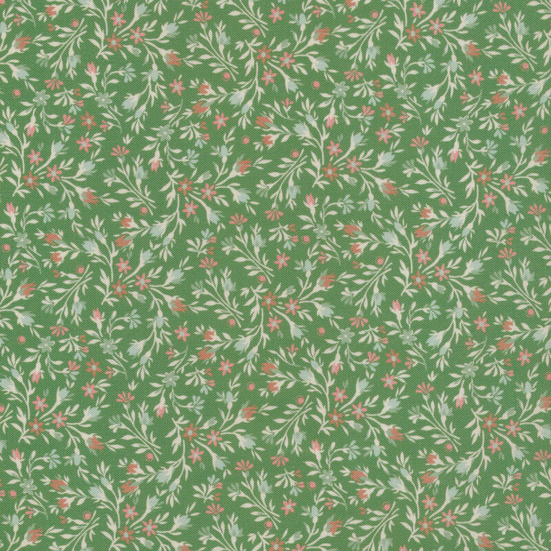 Light floral print with small pink flowers against a green fabric.