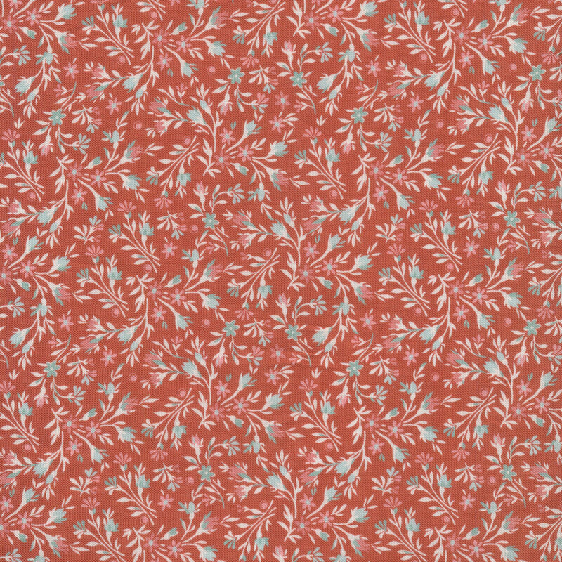 Light floral print with small pink flowers against a red fabric.