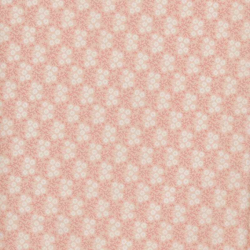 Floral print with small white flowers against a light pink fabric.