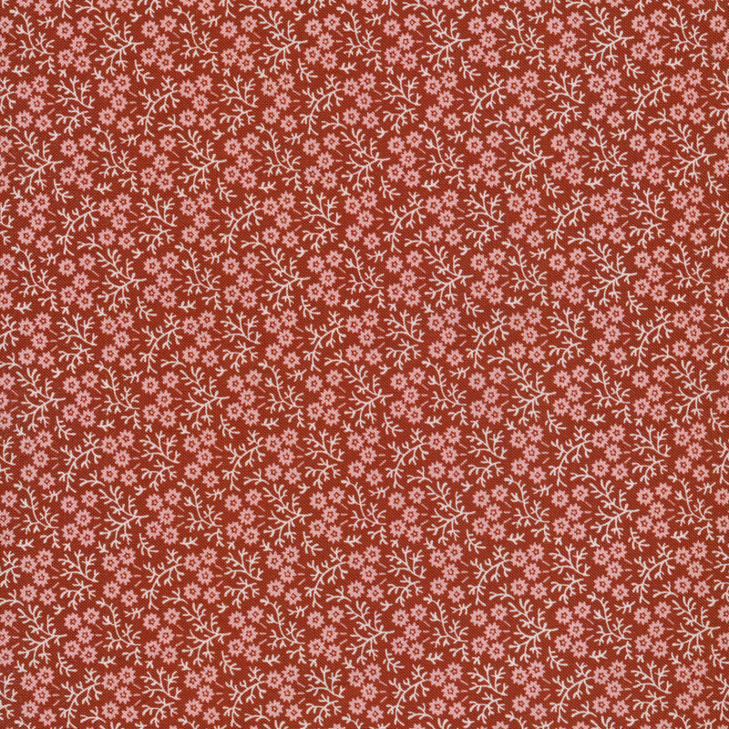 Floral print with small pink flowers against a red fabric.