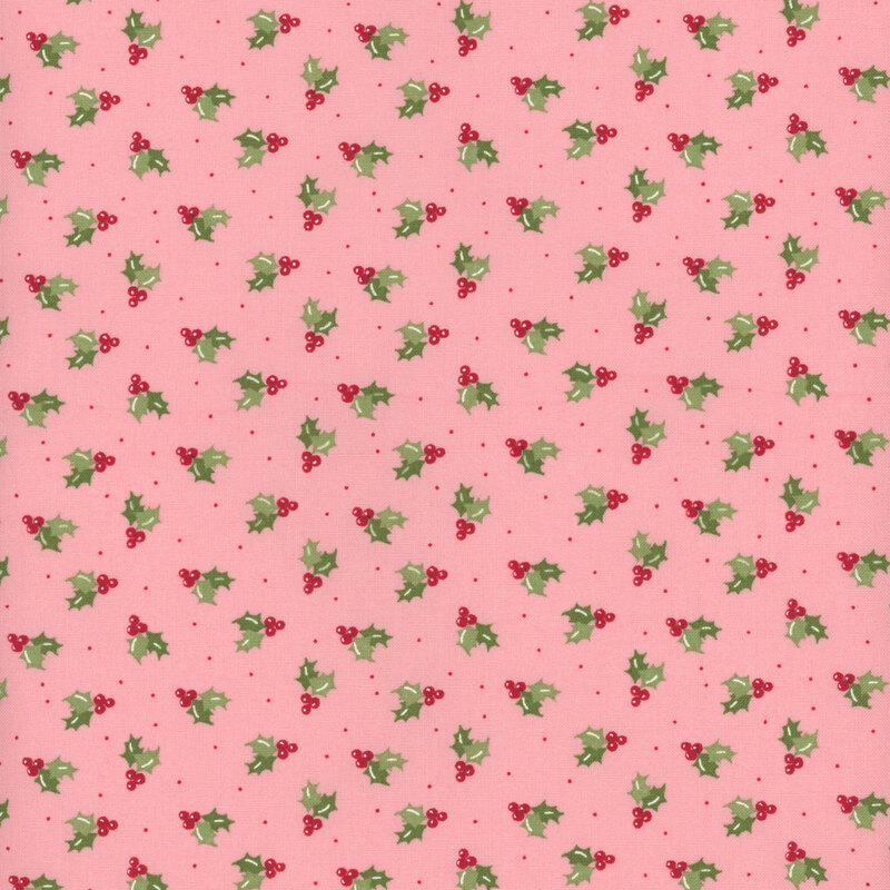 Light pink fabric featuring red holly berries and leaves with small tonal dots tossed all over