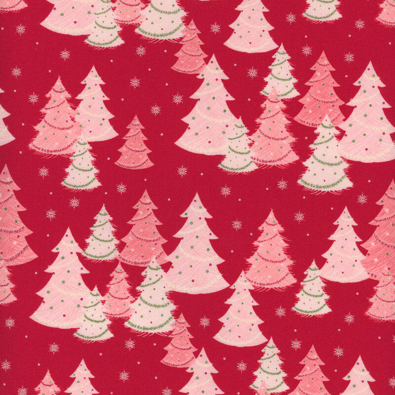 Red fabric with scattered pink and white evergreen trees with decorations like lights and garland with small snowflakes