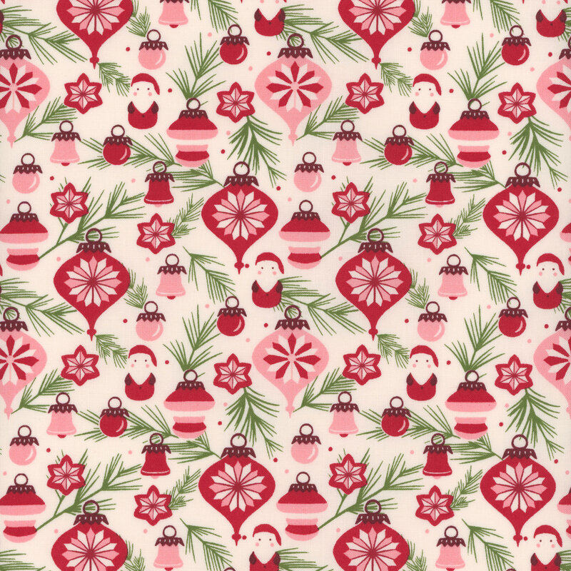 White fabric with green pine branches and assorted baubles in white, pink, and red with some Santa ornaments.