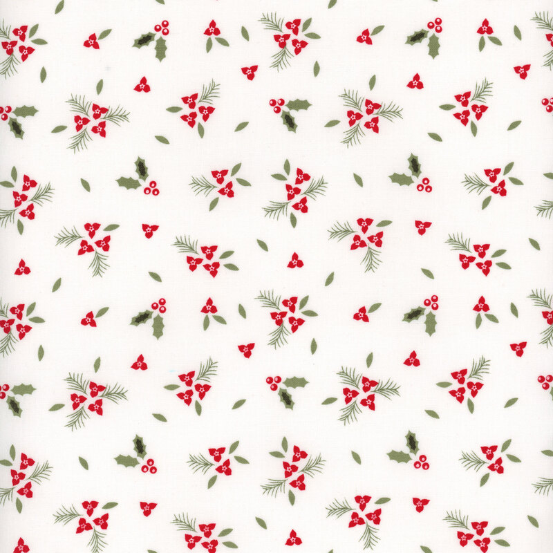 Small clusters of red holly berries and flowers with green leaves and pine branches tossed all over white fabric