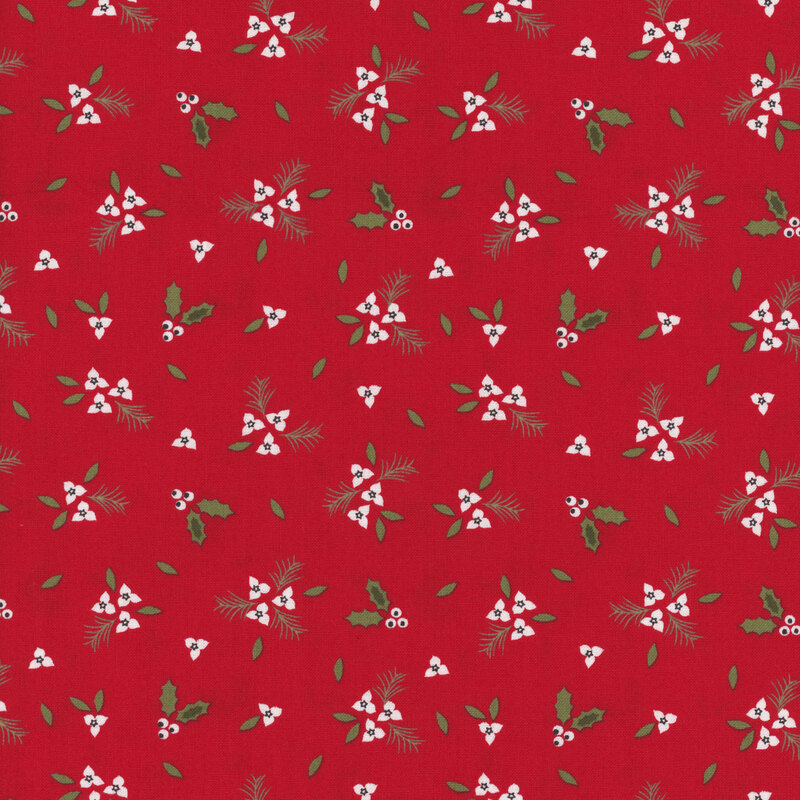 Small clusters of white holly berries and flowers with green leaves and pine branches tossed all over red fabric