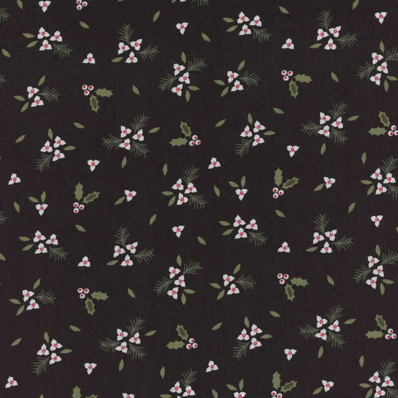 Small clusters of white holly berries and flowers with green leaves and pine branches tossed all over black fabric