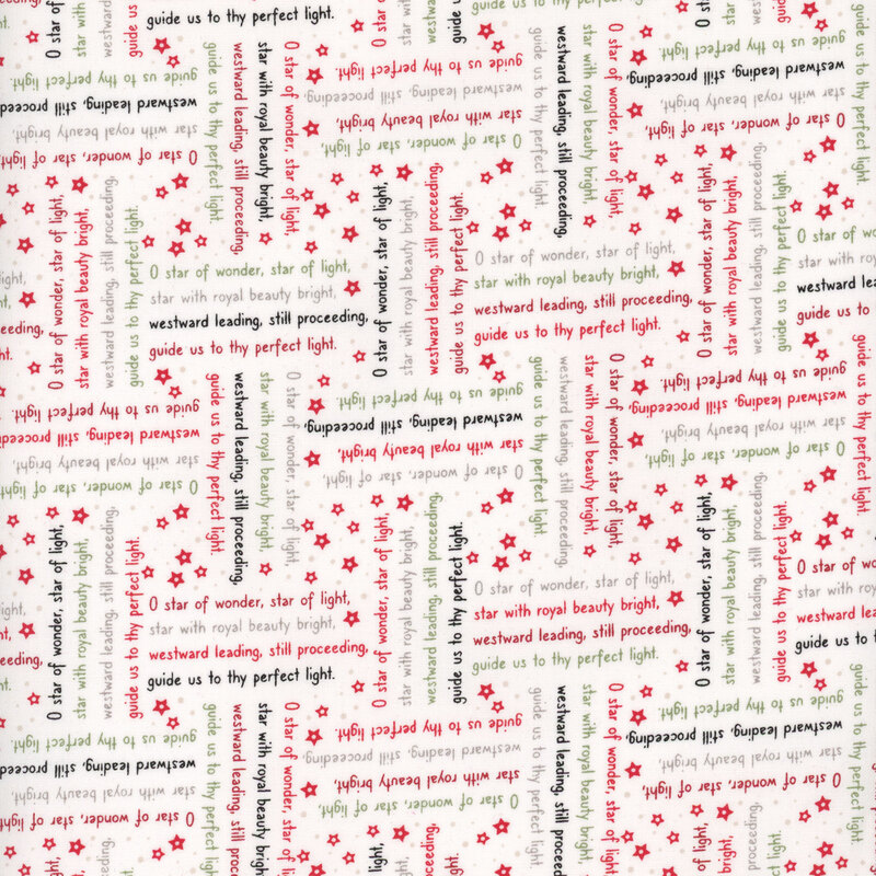 White fabric with lines from the We Three Kings Christmas carol in red, green, black, and taupe arranged in stanzas perpendicular to one another.