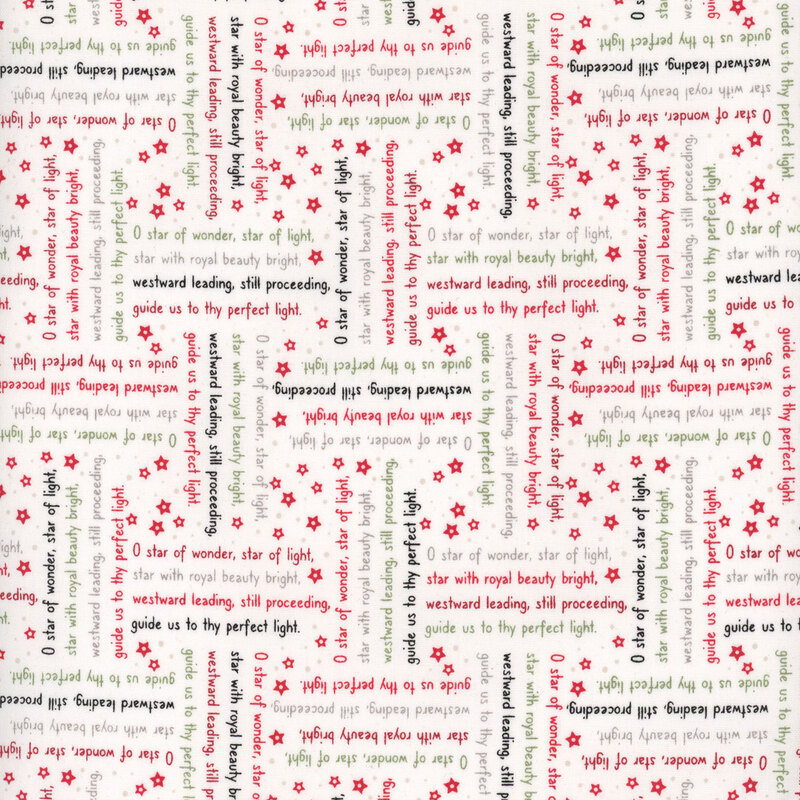 White fabric with lines from the We Three Kings Christmas carol in red, green, black, and taupe arranged in stanzas perpendicular to one another.