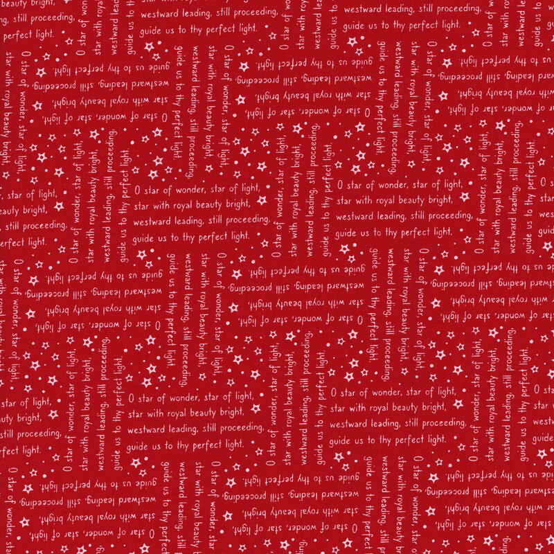 Red fabric with lines from the We Three Kings Christmas carol in white arranged in stanzas perpendicular to one another.