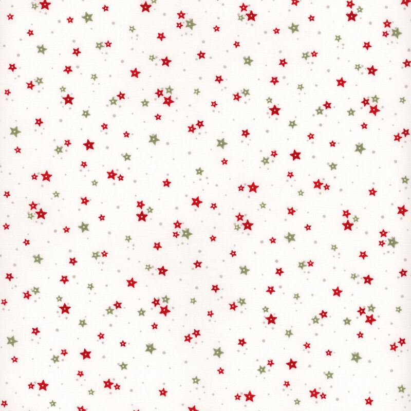 White fabric with clusters of red and green stars with tiny green dots scattered in the background