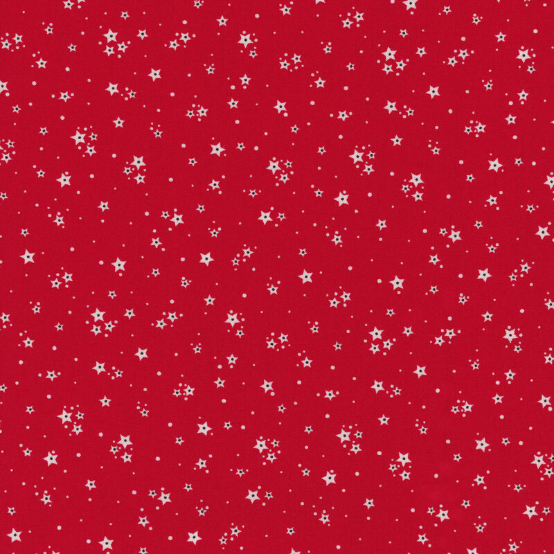 Red fabric with clusters of white stars with tiny dots scattered in the background