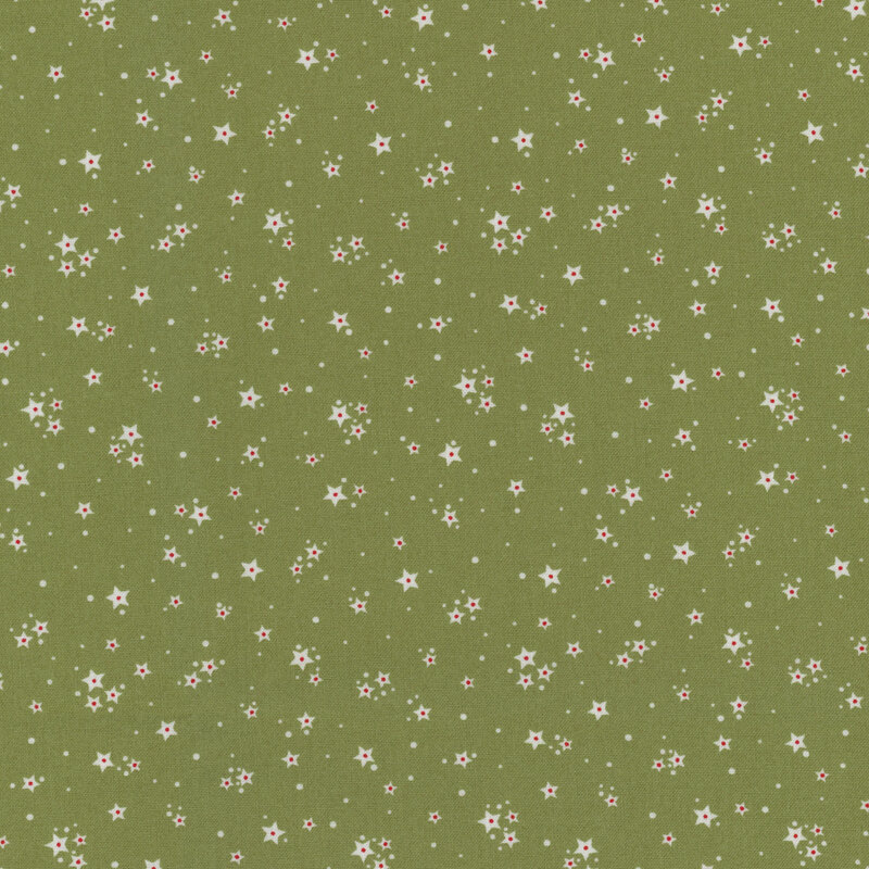 Green fabric with clusters of white stars with a tiny red accent and tiny dots scattered in the background