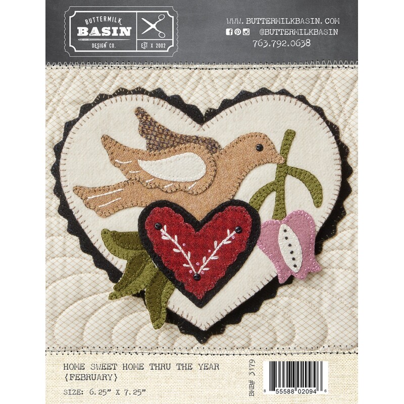 Front of pattern depicting a beautiful woolen bird carrying a flower in its beak, perched on a heart shaped nest