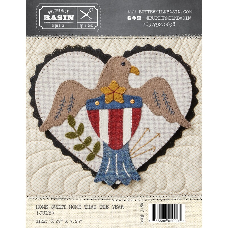 Front of pattern with finished heart featuring a brown eagle and a patriotic crest 