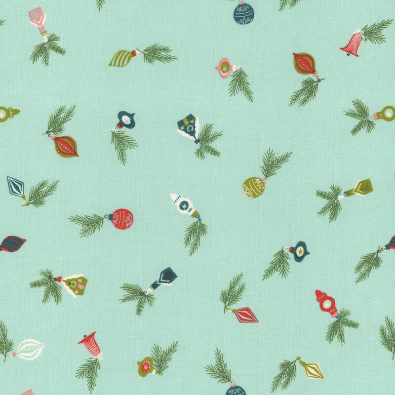 aqua fabric with scattered Christmas ornaments in shades of pink, red, green, and teal
