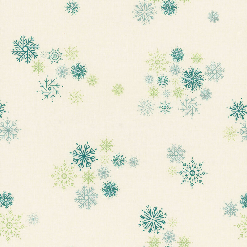 lovely natural white fabric with scattered teal, green, and aqua snowflakes