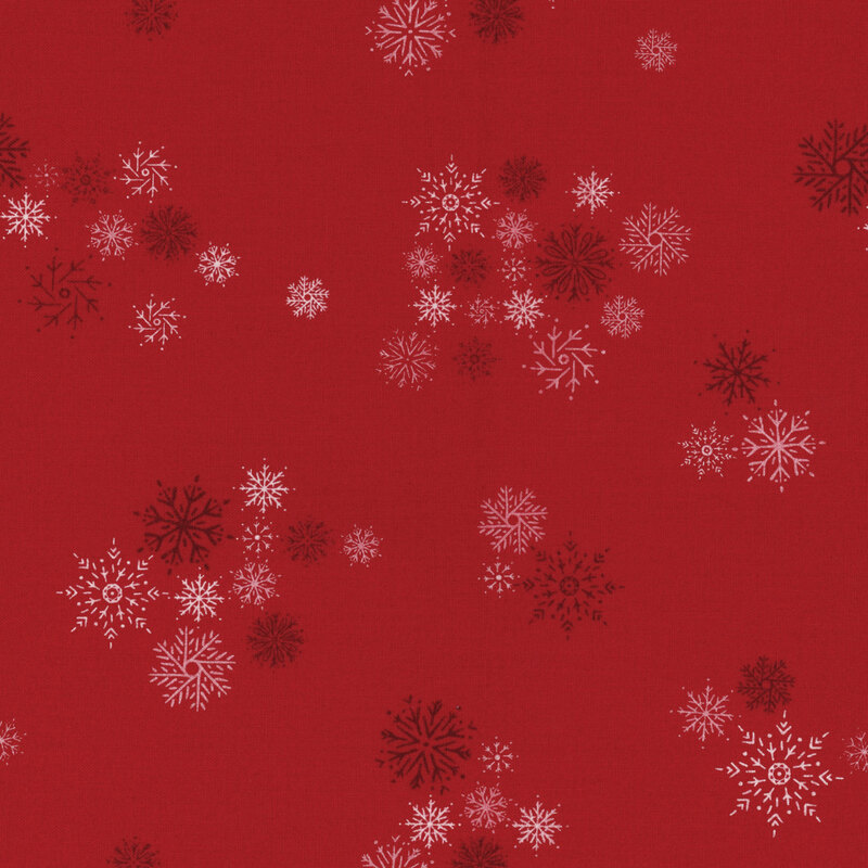 red fabric with scattered dark red and white snowflakes