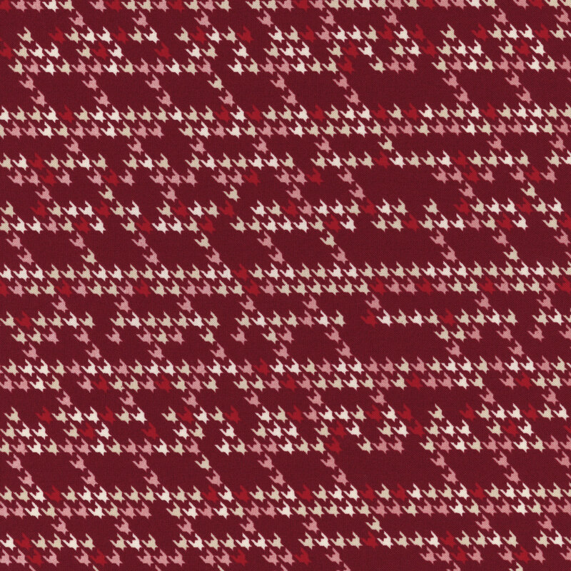 burgundy fabric with a modern interpretation of the houndstooth design in shades of cream, tan, pink, and red