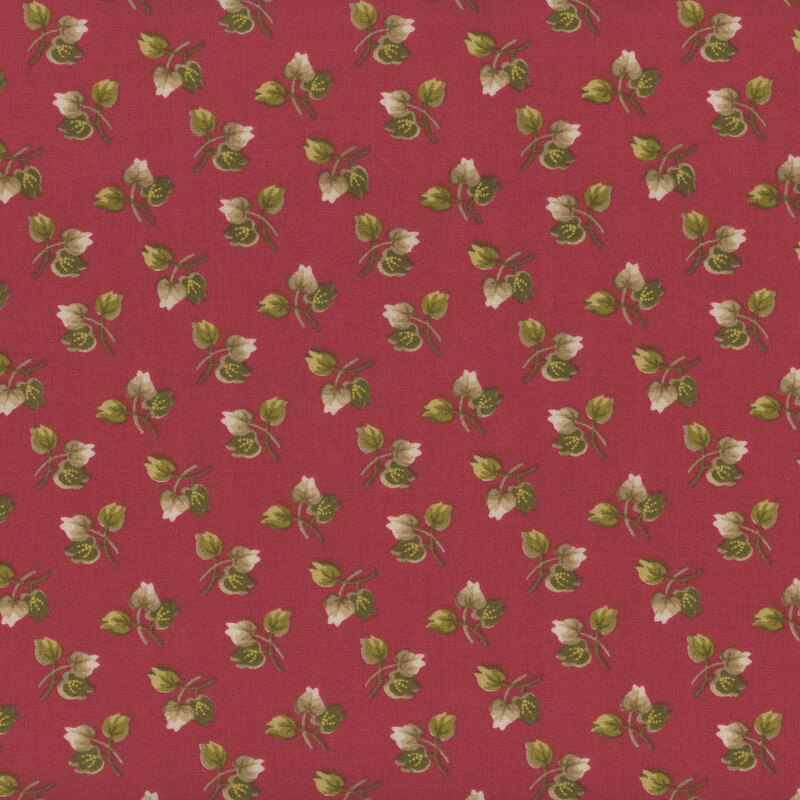Cranberry colored fabric with sprigs of 3 leaves tossed all over