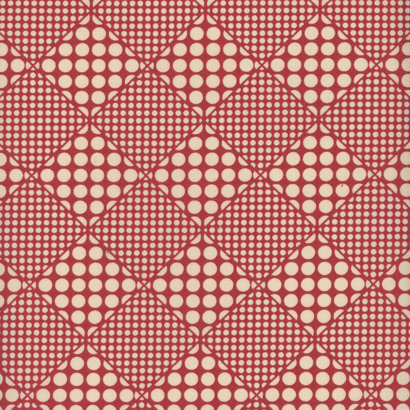 Cream and red fabric with a checkerboard-like pattern of diamonds filled with different sized dots