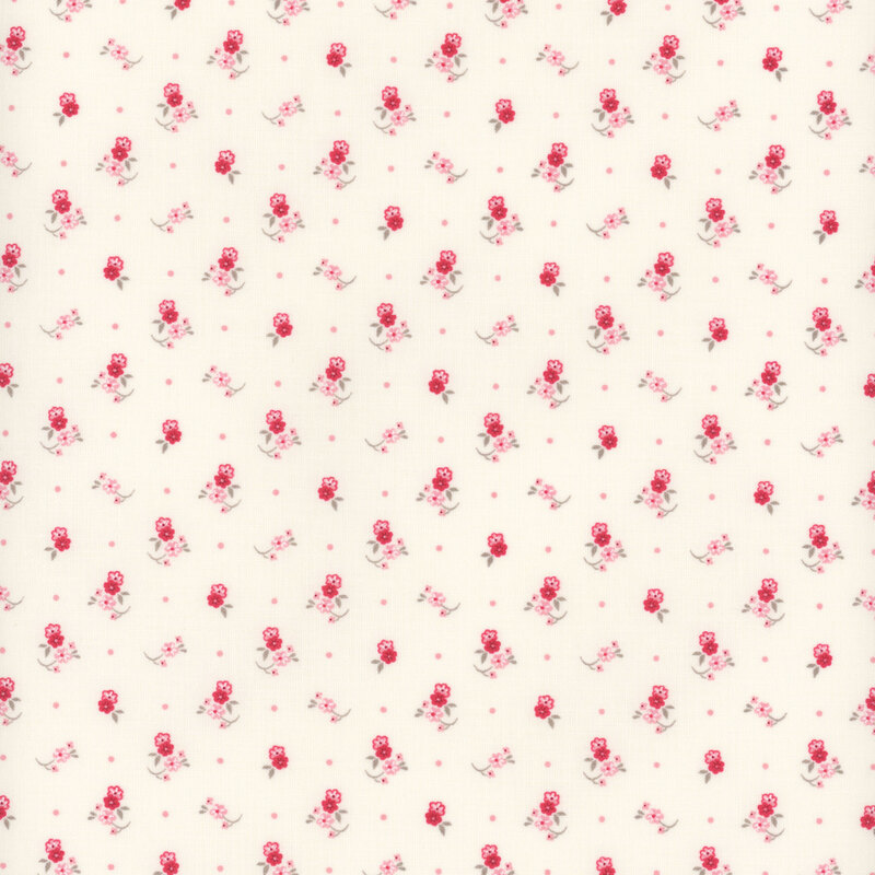 Small pink and red floral motifs, like little corsages tossed onto a cream fabric